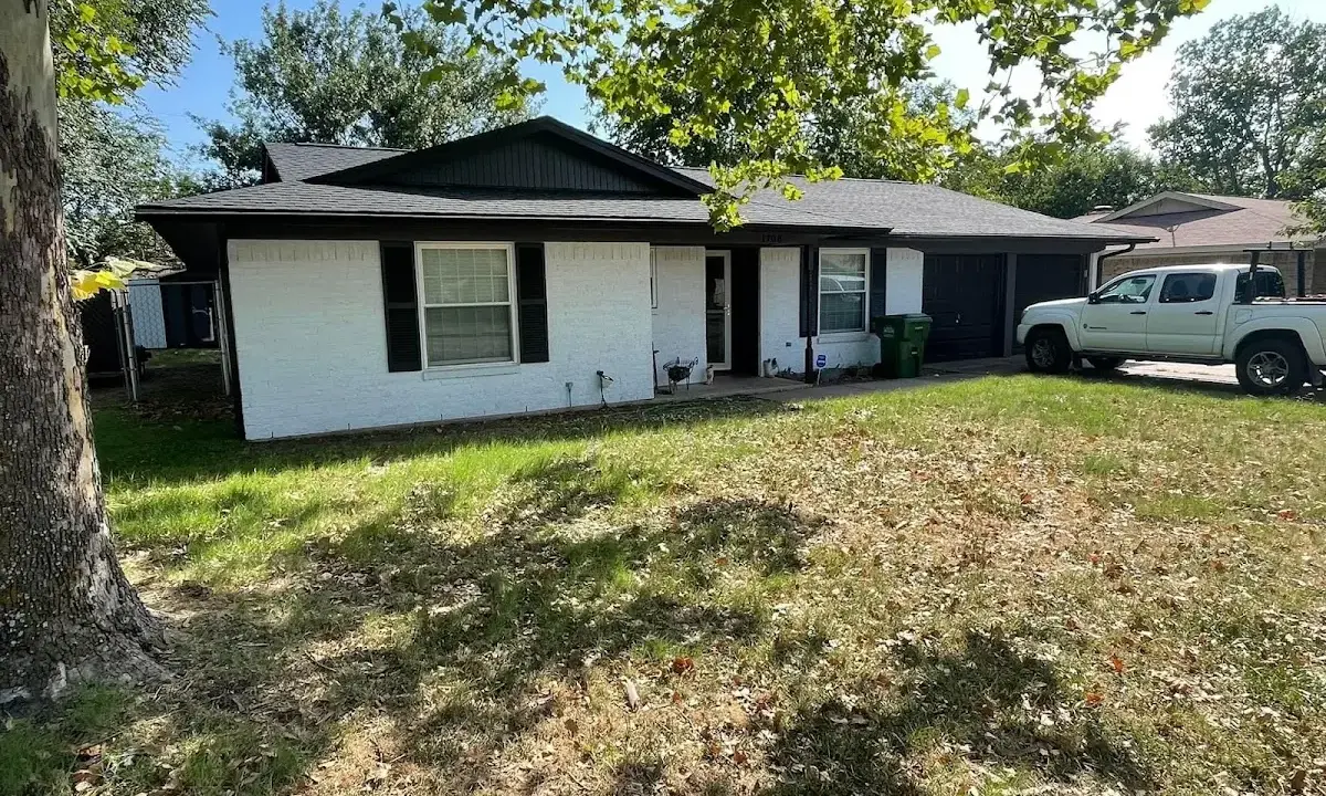 Professional roofing crew working on a residential roof in St. Cloud